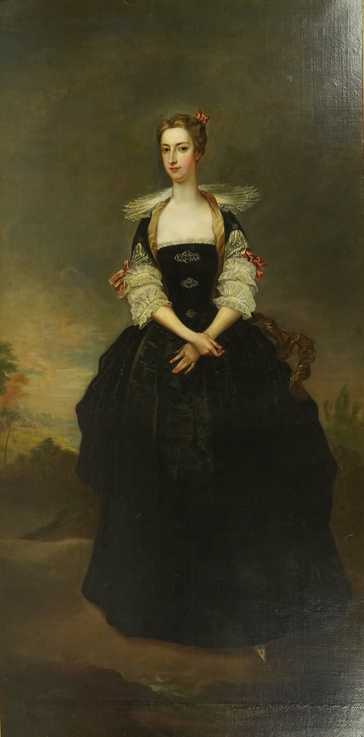 Charles Jervas (English, c.1675-1739), Portrait of a lady said to be a member of the Dundas Family, full length in black Van Dyck dress, in a landscape, oil on canvas, 255 x 127cm